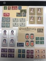 Full overview of various Canadian stamps, some blocks of four, unhinged condition on album page.