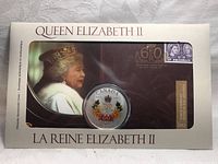 Front of the sealed pack showing Queen Elizabeth II portrait and visible coin.