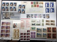 Full overview of stamp collection including loose stamps, sheets, letter with stamps