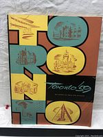 Front cover of the book 'Toronto 59' showing vintage illustrations of Toronto landmarks in a distinctive mid-century design.