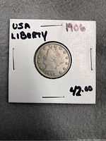 Front of 1906 Liberty Head Nickel coin showing Lady Liberty profile.