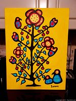 Full front view of painting showing stylized tree and birds against yellow background