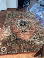 Full view of rectangular rug laid on hardwood floor