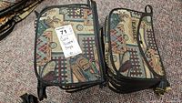 Photo showing multiple personal golf bags featuring tapestry fabric with golf-themed designs, labeled with lot tag.