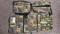 Four pieces of personal travel gear with patterned fabric showing golf and wilderness motifs