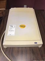 Top view of beige flatbed scanner showing OpticPro 4800P logo and unit surface.