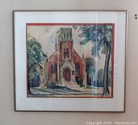 Full view of the framed watercolor painting depicting a church, matted and framed in a simple metal frame.