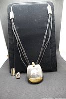African inspired elephant necklace and earrings on display stand
