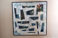 Overall view of the framed abstract painting showing the composition and colors.