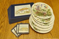 Image showing 6 circular floral placemats stacked and 4 rectangular placemats and 4 coasters arranged to display designs.