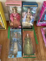 Four boxed Barbie dolls from different world cultures, two dolls shown in each of two images from front packaging.