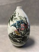 Front view of the 7 inch Jingdezhen porcelain vase showing detailed hand-painted landscape including mountains, trees, and houses in multiple colors.