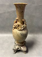 Front view of the Shoushan stone vase showing the full shape and carved base.