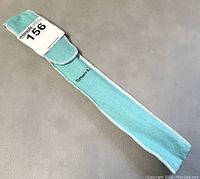 Turquoise velvet pouch laid flat showing Tiffany & Co logo on flap