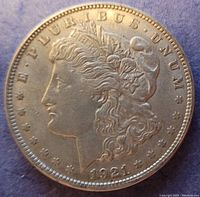 Obverse side of the 1921 Morgan silver dollar showing Lady Liberty's profile, inscriptions, and date.
