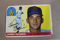 Front of the 1955 Topps Harmon Killebrew rookie card showing player portrait, smaller action pose, team logo, name, position, and team name.