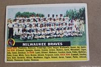 Front view of the 1956 Topps Milwaukee Braves Team Card #95 showing team photo with player names listed beneath.