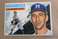 Front of 1956 Topps Warren Spahn card showing portrait and action shot with signature.