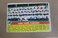 Front side of the 1956 Topps Yankees Team baseball card numbered 251, showing team photo and player names.