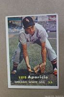 Front of 1957 Topps Luis Aparicio baseball card showing player in Chicago White Sox uniform.