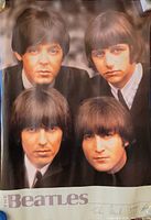 Front view of the Beatles 1964 poster showing the four band members with their hairstyles and suits, title 'The Beatles' on left edge.