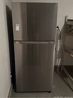 Front view of closed refrigerator showing stainless steel finish and Samsung logo