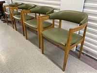 Four chairs in a row showing overall set and matching style