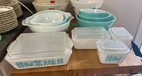 Group shot of all three turquoise mixing bowls at rear and three turquoise-on-white Butterprint covered dishes at front