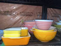 Overall view of stacked bowls and dishes on shelving
