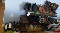 First image shows three pairs of shoes and three pairs of boots arranged on top shelf