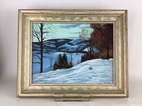 Front view of framed original winter landscape painting featuring snow-covered hills and trees, signed by artist Scollon.