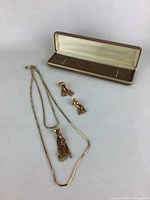 Full view of necklace, earrings, and jewelry case