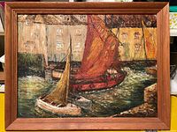 Full framed oil painting depicting sailboats with varying sail colors in a harbor with buildings in background.