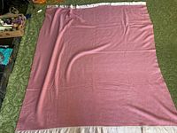 Full view of the vintage wool blanket laid flat showing entire piece and beige hemmed edge.