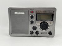 Front view of Grundig S350 radio receiver showing speaker, tuning dial, knobs and digital display panel
