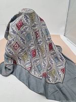 Liberty of England vintage silk scarf draped to show pattern and texture with gray border.
