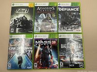 Photo showing all six Xbox 360 games together on a flat surface, clearly displaying cover art of each game.