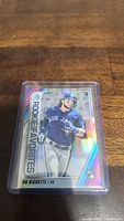 Front view of Bo Bichette Rookie baseball card in protective plastic sleeve, showing holographic detailing and player image.