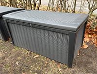 Side angle showing textured woven pattern and upright rectangular shape