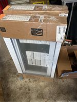 Two new hopper replacement windows in original packaging with brand and size labels visible.