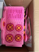 Top view of the pink La La Loopsi Easy Bake Oven showing four burners and oven grill on top