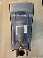 Front view of the ZeroWater water pitcher showing the built-in dispenser tap and visible white filter inside.