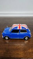 Side profile view of the Mini Cooper model car showing overall condition and Union Jack roof design.