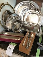 Overall assortment of silver-plated trays, platters and dishes arranged together