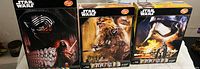 Photo showing the three unopened Star Wars cereal boxes with different character artwork on each box.