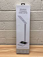 Front view of the boxed Wireless Charging Desk Lamp showing image and key features