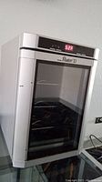 Front view of the Danby Maitre D wine cooler showing digital temperature display and glass door with racks inside.