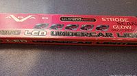 Close up photo of the packaging showing the ARAD brand and ULS400 series for the LED undercar lighting kit with strobe, scan glow, and music reactor features.