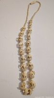 Full view of the entire elephant bead necklace showing length and design.