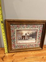 Side view with tape measure showing approximate height of framed print around 15 inches.
